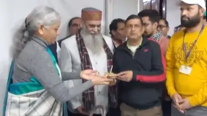 Nirmala Sitharaman serves halwa to colleagues