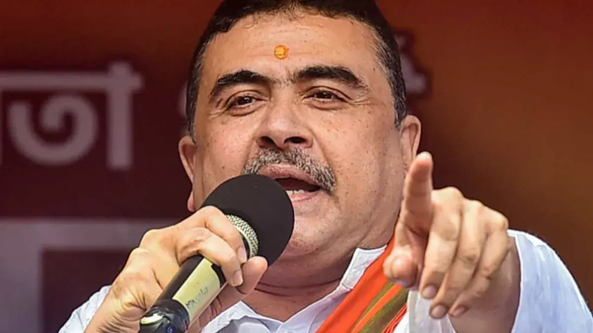 During the festive season in West Bengal, BJP leader Suvendu Adhikari voices concerns about alleged land encroachment in Kasba, prompting calls for action amidst Durga Puja