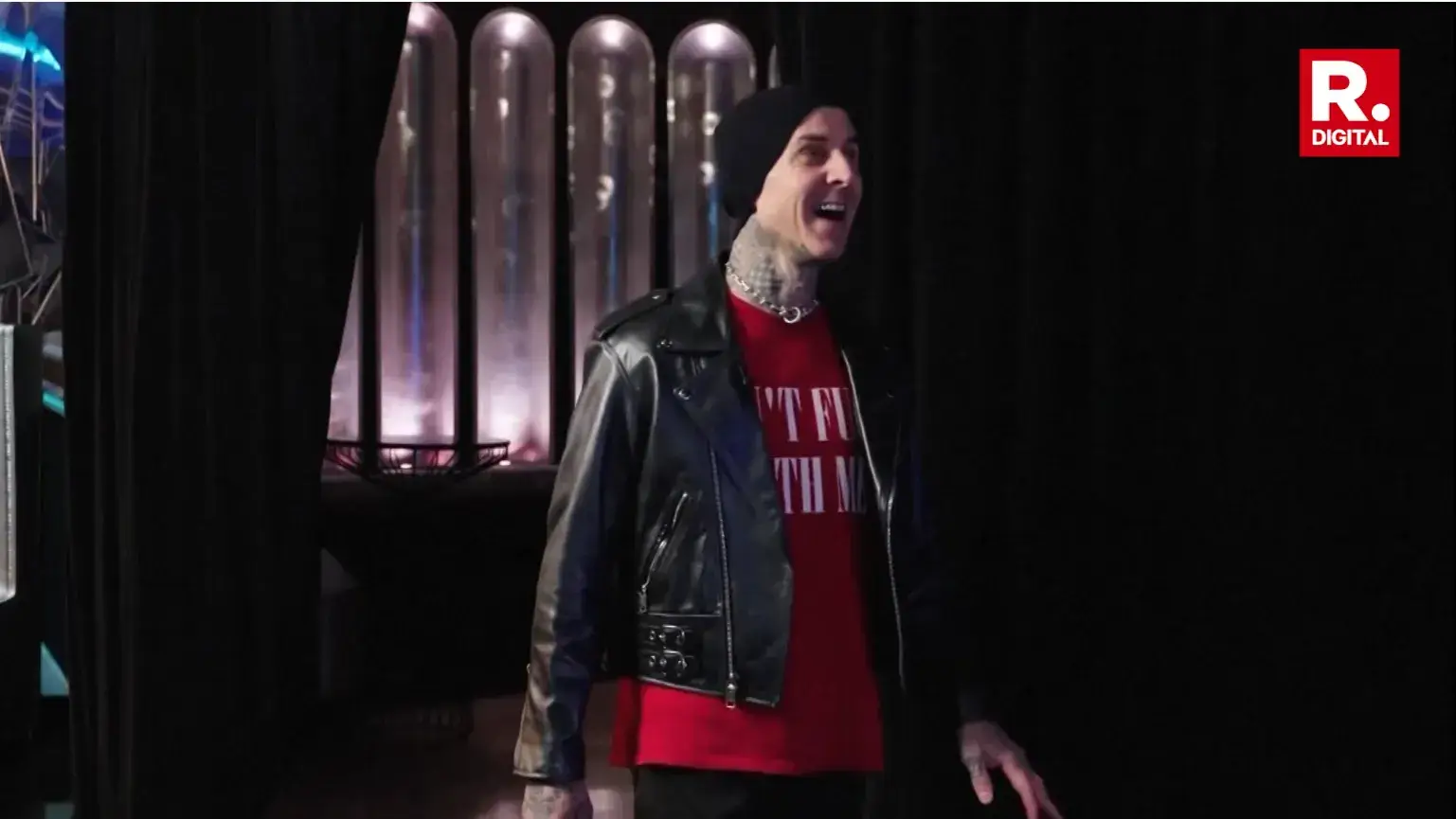 Travis Barker is visibly impressed when faced with his waxwork