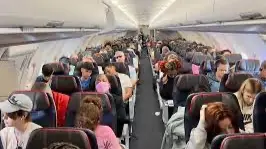 WATCH | Australian Woman Texts Her Boss Claiming To Be Sick, Finds Him On The Same Flight Australian Woman Texts Her Boss Claiming To Be Sick, Finds Him On The Same Flight