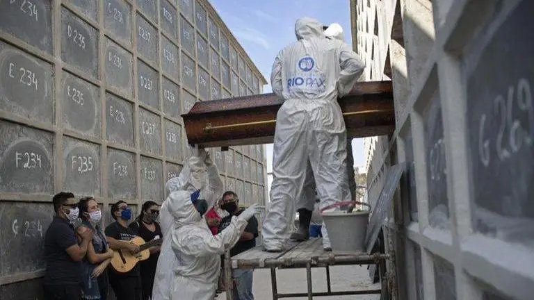 Virus surge in Brazil brings a coffin shortage, morgue chaos