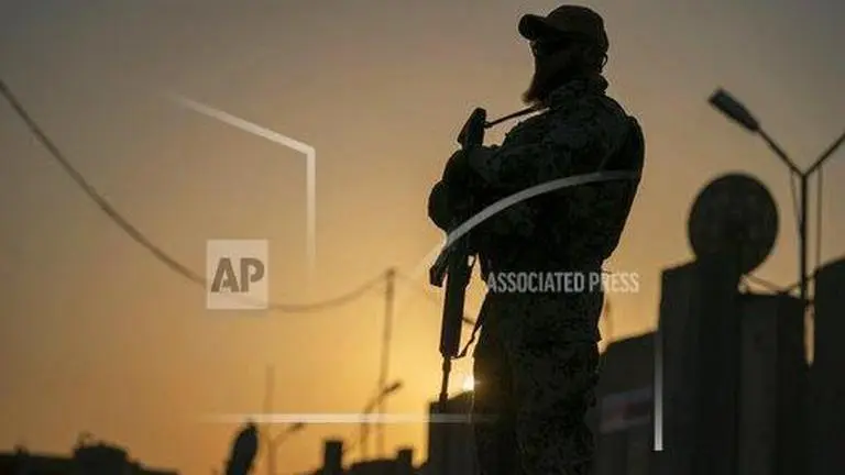 Three service members were killed, including two Americans, and a dozen more were injured when a barrage of rockets were fired at a military base in Iraq, U.S. officials said Wednesday.