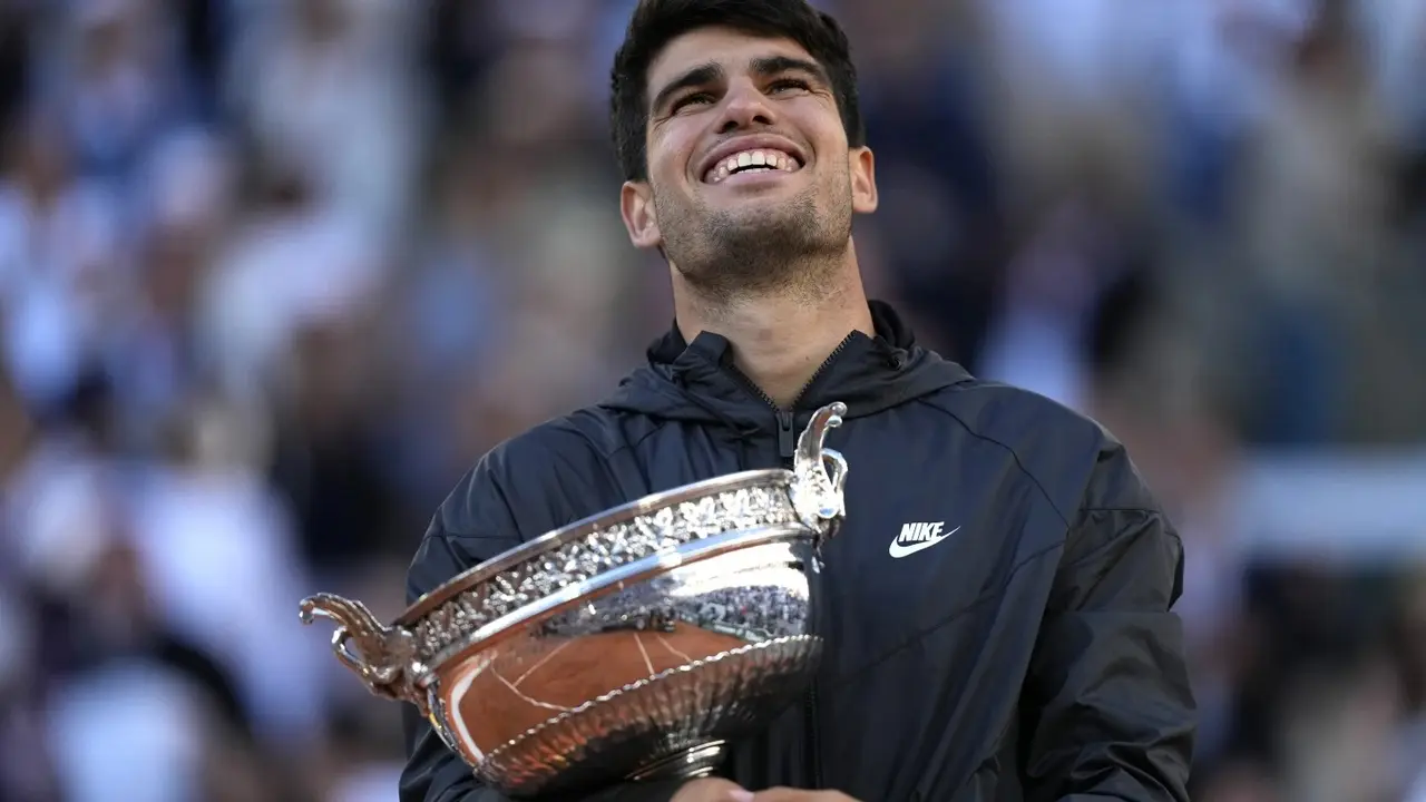 Carlos Alcaraz owns 3 Grand Slam titles at age 21 and his Wimbledon title defense starts July 1 Carlos Alcaraz with his French Open title