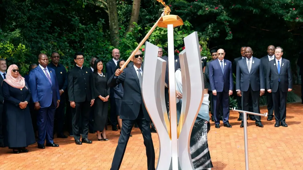 Rwanda Commerates 30th Anniversary of Genocide that Resulted in 800,000 Deaths Rwanda' President Paul Kagame lighting the memorial flame at the Kigali Genocide Memorial.