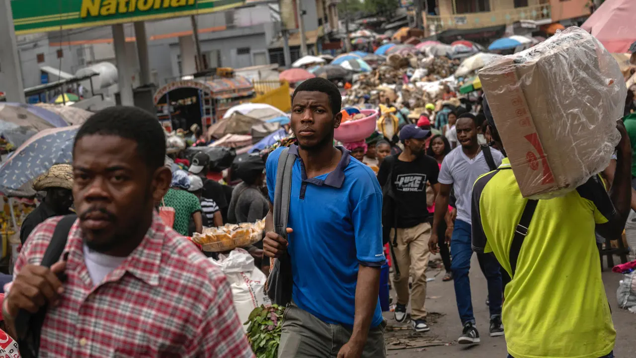 People walk through a street market in Port-au-Prince, Haiti, April 26, 2024.