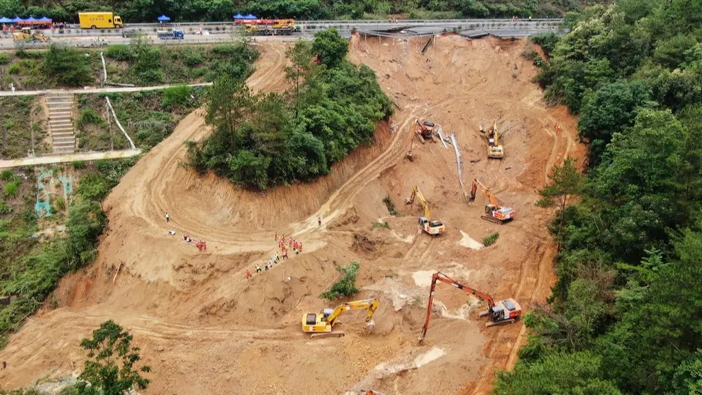 After the collapse of a bridge section in southern China, dozens of vehicles were sent tumbling down the steep slope.