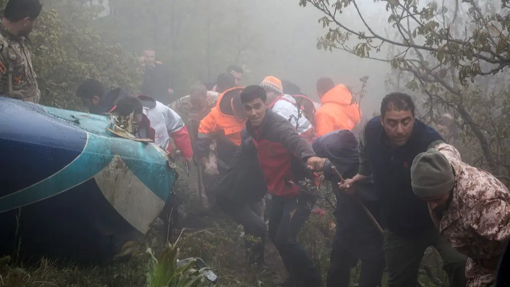 Iran Helicopter Crash Shows Tehran's Reliance on an Aging Fleet As Well As Its Challenges at Home Rescue team members work at the scene of a crash of a helicopter carrying Iranian President Ebrahim Raisi in Varzaghan in northwestern Iran.