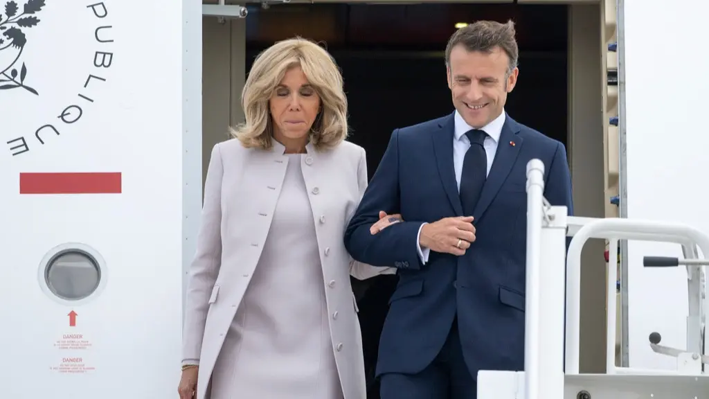 French President Emmanuel Macron arriving in Berlin alongside First Lady Brigitte Macron.