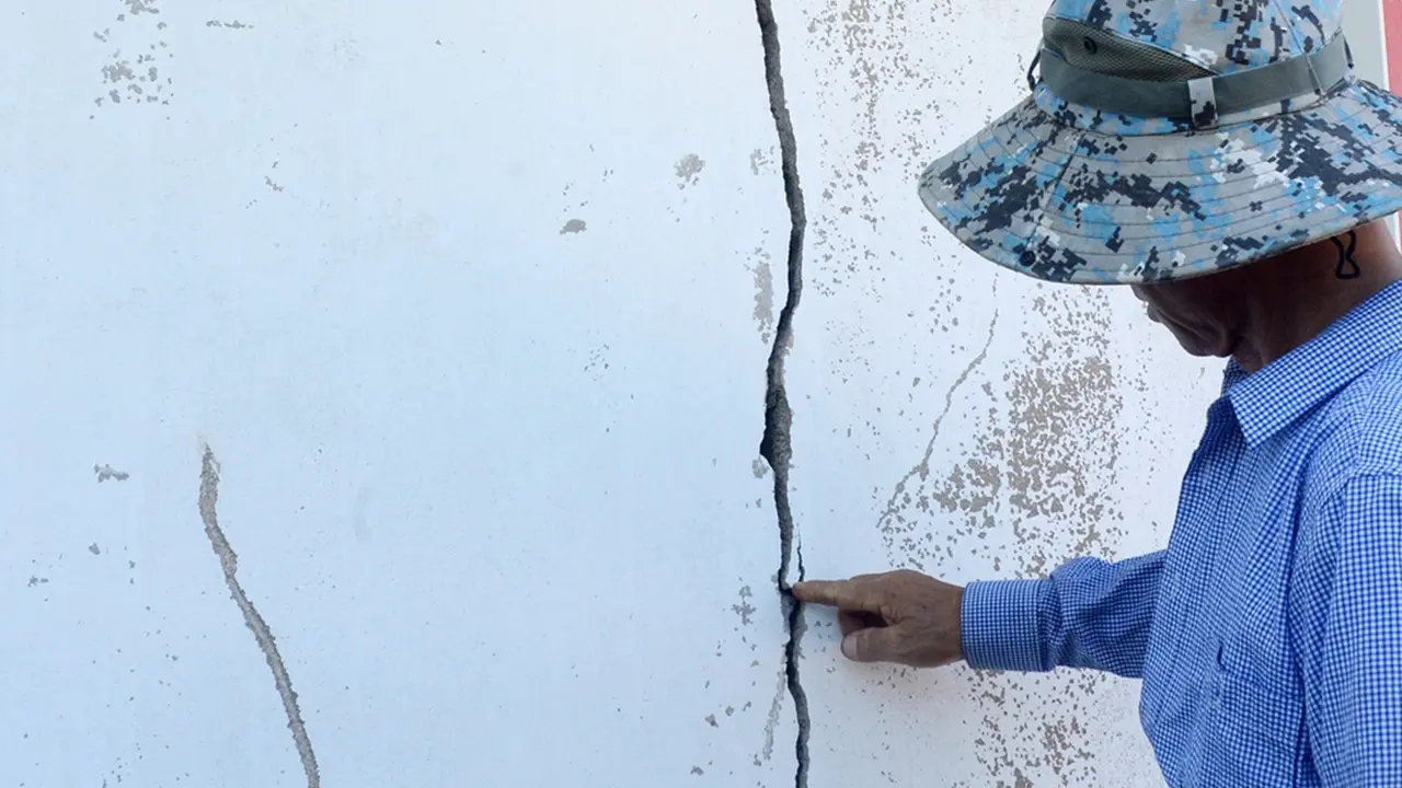 4.8 Magnitude Earthquake Strikes Southwestern South Korea, Causing Wall Cracks and Minor Damage A resident points a cracked wall at a home damaged by an earthquake in Buan, South Korea