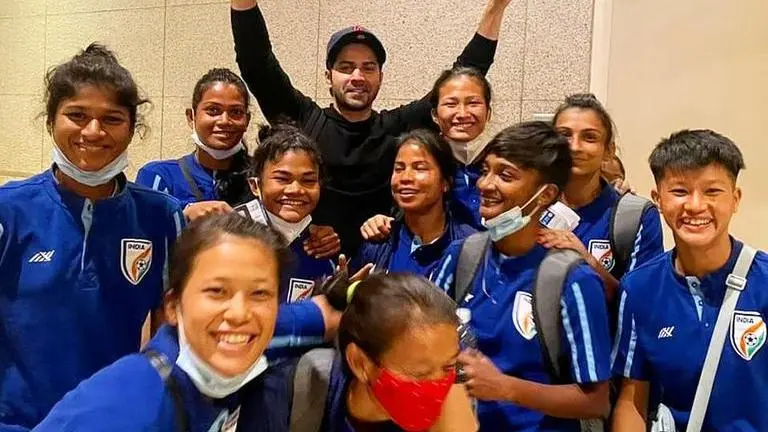 Indian Women's Football Team bumps into Varun Dhawan as they leave for Brazil; see pics Varun Dhawan, indian women's football team