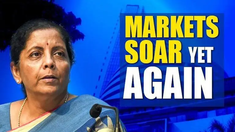 Sensex gains over 900 points and Nifty rises over 300, post tax cut Sensex