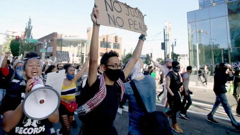 Protesters march in Portland amid nightly tensions