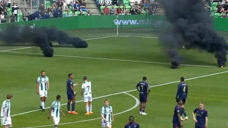 Dutch league game called off as supporters hurled bombs, flares on the pitch Ajax vs Groningen