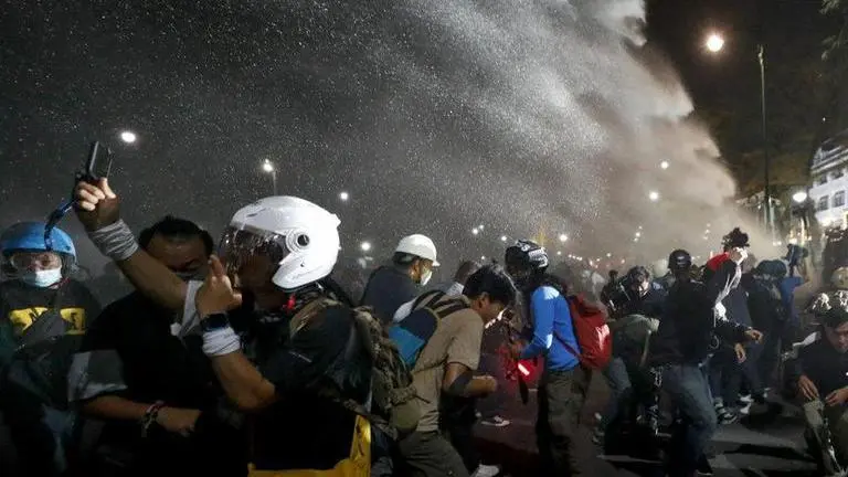 Thai protesters defy police water cannons to deliver letters about political grievances Thailand