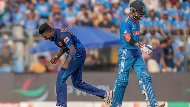Dilshan Madushanka celebrates after dismissing Virat Kohli