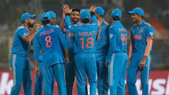 Team India celebrate after a wicket