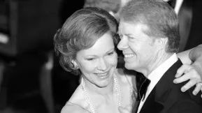 Former US First Lady Rosalynn Carter dances with her husband ex-President Jimmy Carter