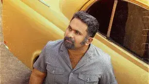 Varshangalkku Shesham: Aju Varghese Sports Salt-And-Pepper Look In New Poster Aju Varghese in Varshangalkku Shesham