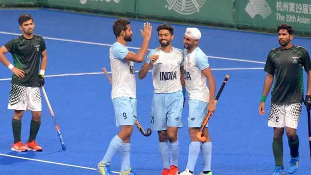 Indian players celebrating a goal against Pakistan