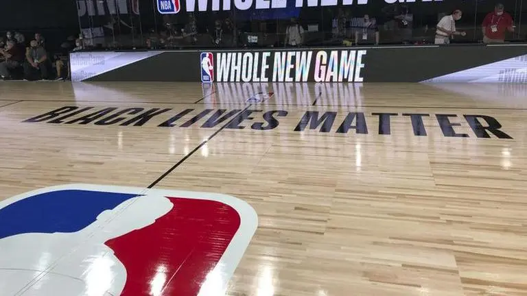 For the NBA, it’s time to play, kneel and demand change