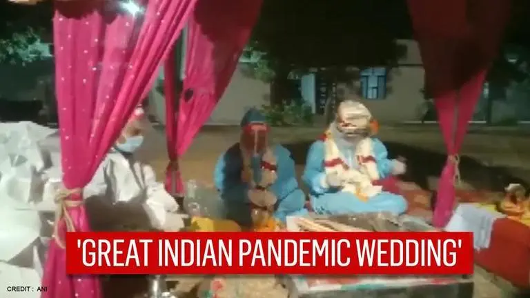 Rajasthan couple marries in PPE kits after bride tests COVID positive on wedding day Rajasthan