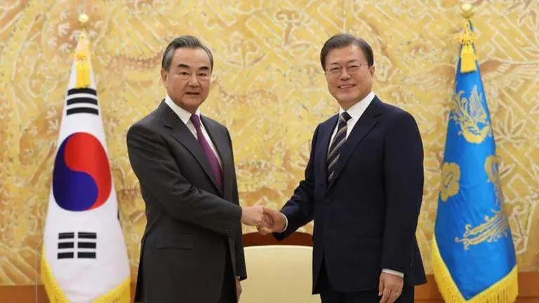 China's FM meets South Korean officials, vows to work on COVID-19 and North Korea China