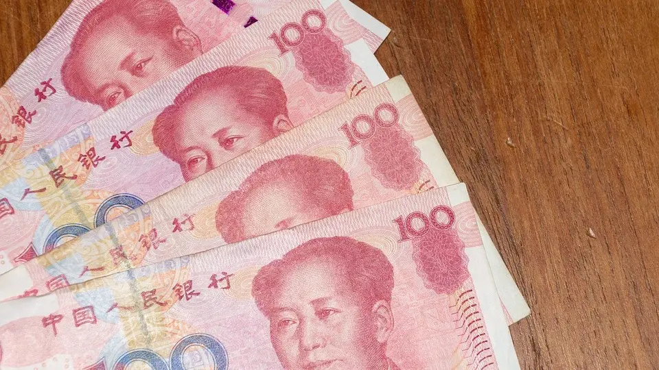 Yuan hits low