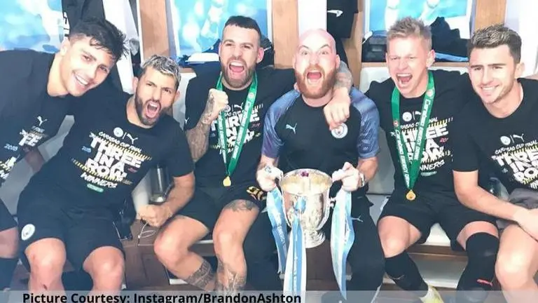 Man City kitman performs hilarious chest slide in dressing room after Carabao Cup win Man City