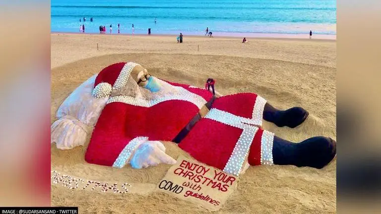 Odisha sand artist Sudarshan Pattnaik makes Santa Claus out of 5400 roses on Puri beach Odisha