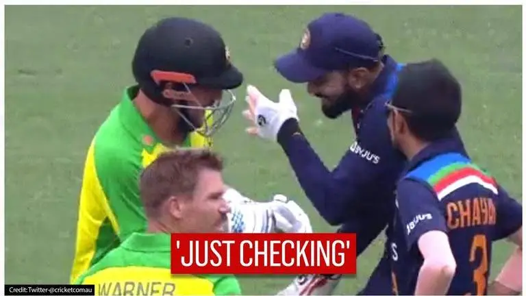 Aaron Finch laughs with KL Rahul after being struck by Navdeep Saini's full toss Aaron Finch