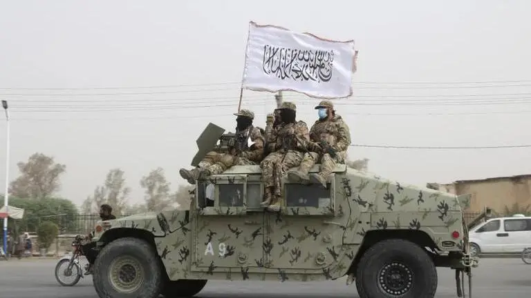 Over 200 former Afghan officials and security forces killed since Taliban takeover, UN says Taliban fighters patrol on the road during a celebration marking the second anniversary of the withdrawal of U.S.-led troops from Afghanistan, in Kan