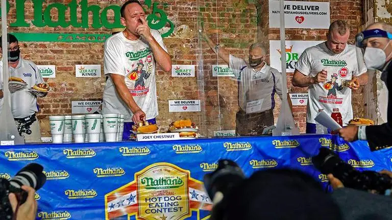 Hot Dog eating champion Joey Chestnut wins 13th title, breaks his own world record Hot dog