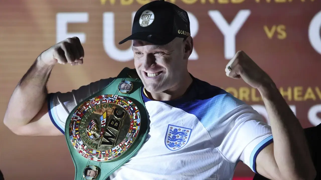 Tyson Fury continues treading offbeat career path with fight against former UFC star Francis Ngannou Tyson Fury poses with the championship during a weigh-in event