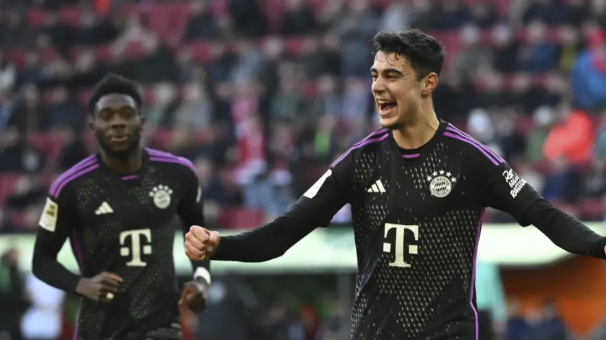 Munich’s Aleksandar Pavlovic celebrates scoring during the Bundesliga soccer match between FC Augsburg and Bayern Munich
