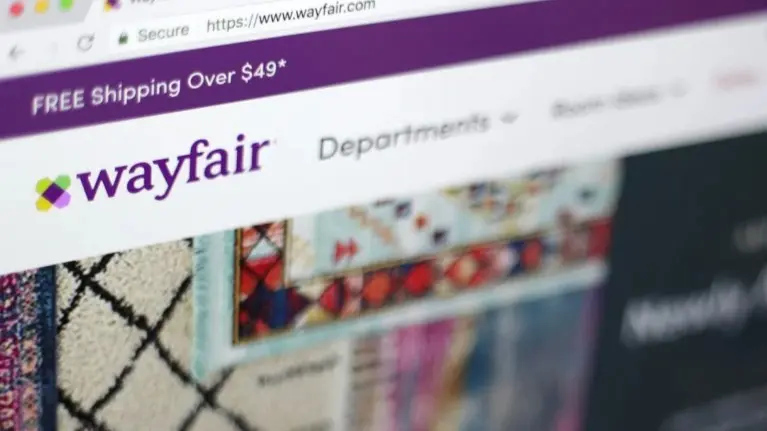'We Went Overboard': Wayfair Lays Off 1,650 Employees, Cuts 13% of Workforce with a Letter File photo shows the Wayfair website on a computer in New York