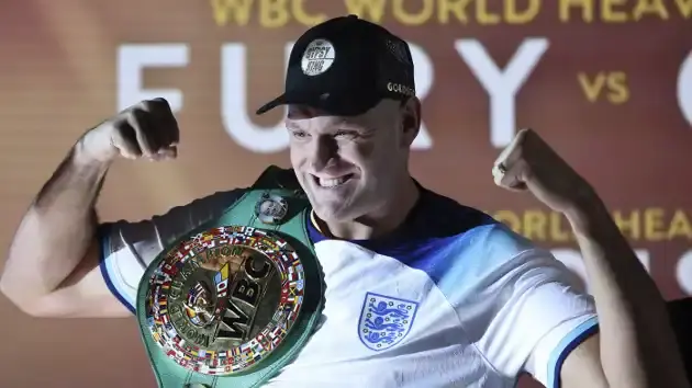 Tyson Fury tries to provoke Francis Ngannou at weigh-in before Saudi Arabia fight Tyson Fury posing with Championship Belt