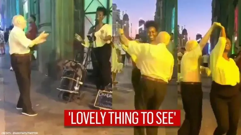 Elderly man shows off dancing skills as he performs with a busker on streets: Watch Elderly Man Dances