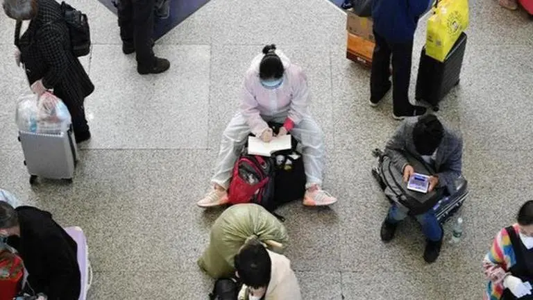 China ends quarantine for overseas travellers amid surge in COVID-19 cases China