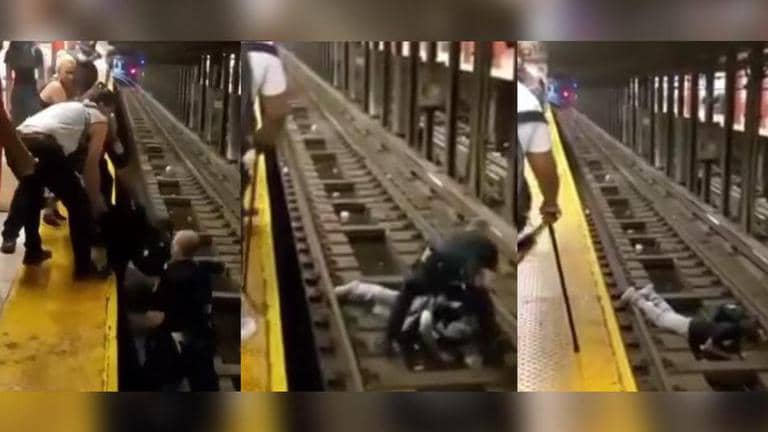 US cop, commuter rescue man who fell on subway tracks; Watch video ...