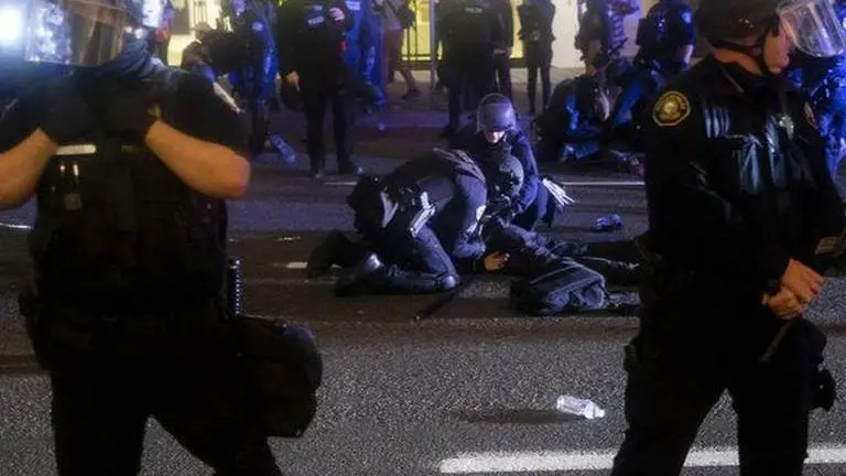 Portland Police declare gathering near a building as 'unlawful' amid violent protests portland Police