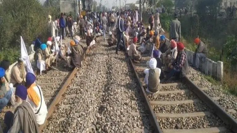 Farmers block railway tracks, demand clearance of sugarcane dues in Punjab Farmers