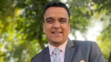 Refugees granted Indian citizenship during a camp with Gujarat minister Harsh Sanghavi present.