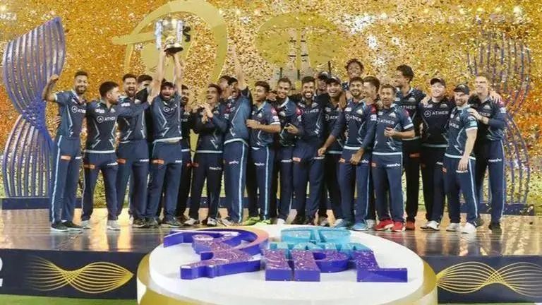 GT Team 2023: Gujarat Titans Schedule, Squad, Best Playing XI For IPL 2023 Gujarat Titans with the IPL trophy