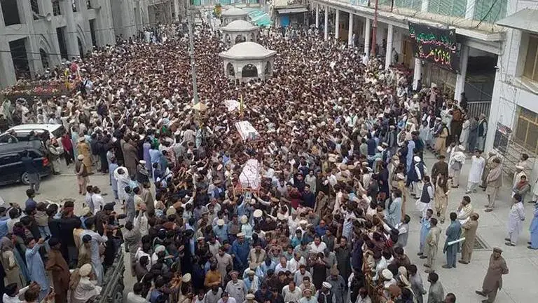 Mourners attend funerals of 7 Shiite teachers in Pakistan's Khyber Pakhtunkhwa province. Pakistan