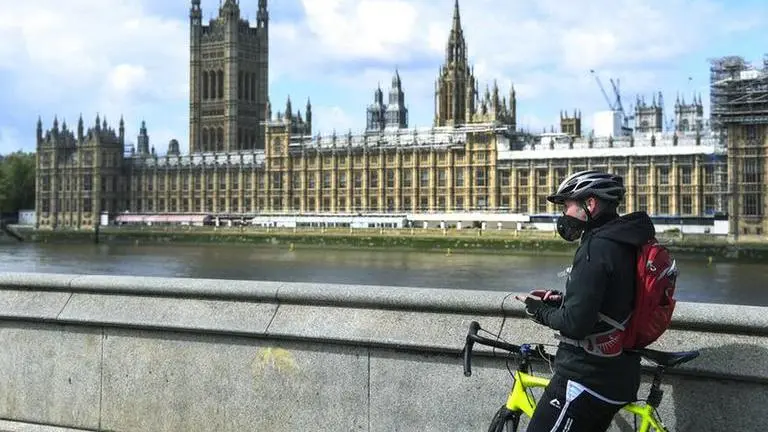 UK lawmakers balk at order to return and end virtual voting