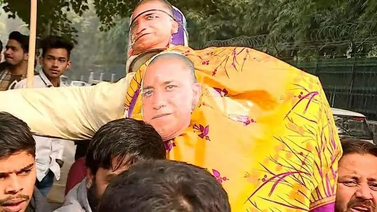 Sexist protest sees Youth Congress clad Yogi effigy in saree, attempt to set it ablaze Indian