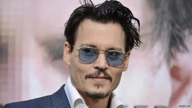 Johnny Depp turns table napkins into a bra amid self-isolation,leaves fans in splits;Watch Johnny Depp