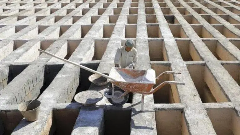 Far from the capital, Iran struggles to bury virus victims