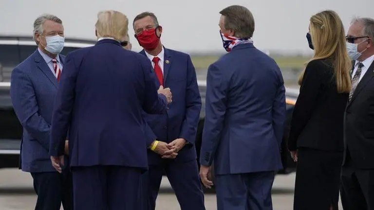 Warnock and Loeffler work to consolidate voters for runoff