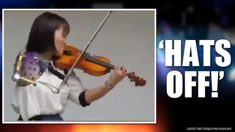 Video: Girl with artificial arm plays violin, netizens laud her 'indomitable spirit' Video: Girl with artificial arm plays violin, netizens laud her 'indomitable spirit'